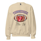Elevate your game-day look with this Tennessee Titans sweatshirt, featuring a football and unique lips and tongue design. Complete with the team's rallying cry "Titan Up" and the iconic Tennessee wordmark, on a sand colored sweatshirt. 