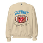 Get ready to show your Detroit Lions pride with this stylish sweatshirt featuring a football and playful lips and tongue design. Complete with the team's slogan "Defend the Den" and the iconic Detroit wordmark, this cozy sand colored sweatshirt. 