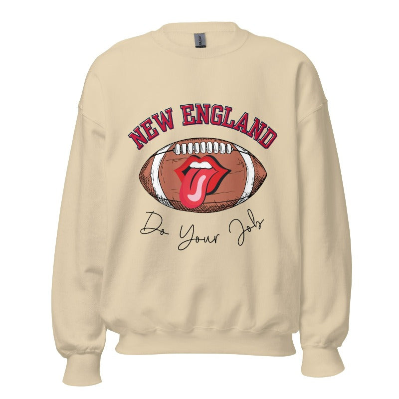 Cheer on the New England team in style with this unique sweatshirt, featuring a football and fun lips and tongue design. Emblazoned with the team's inspiring slogan "Do your Job" and the iconic New England wordmark, this comfortable sand colored sweatshirt. 