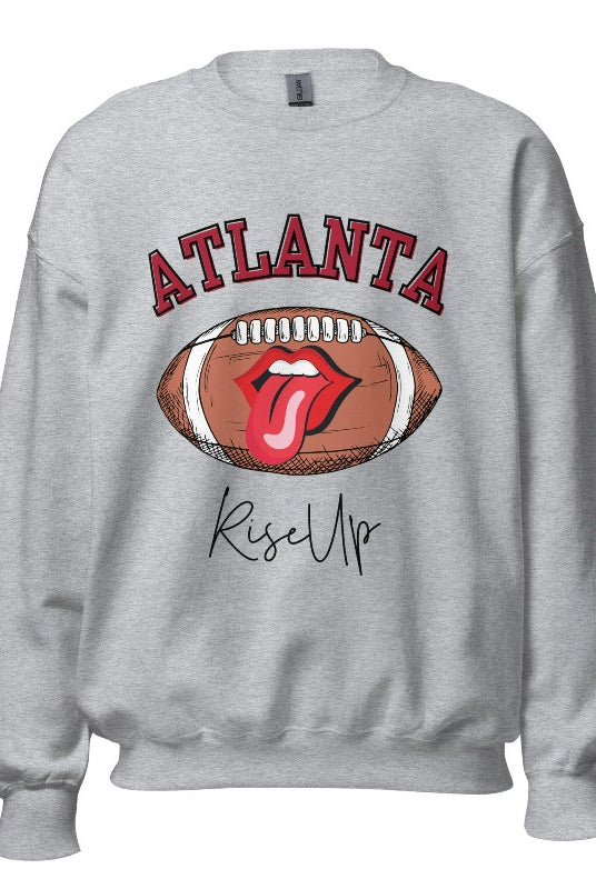 Show your Atlanta Falcons pride with our cozy and warm sweatshirt featuring the team's name and empowering slogan, "Rise Up." ON a sports grey sweatshirt. 
