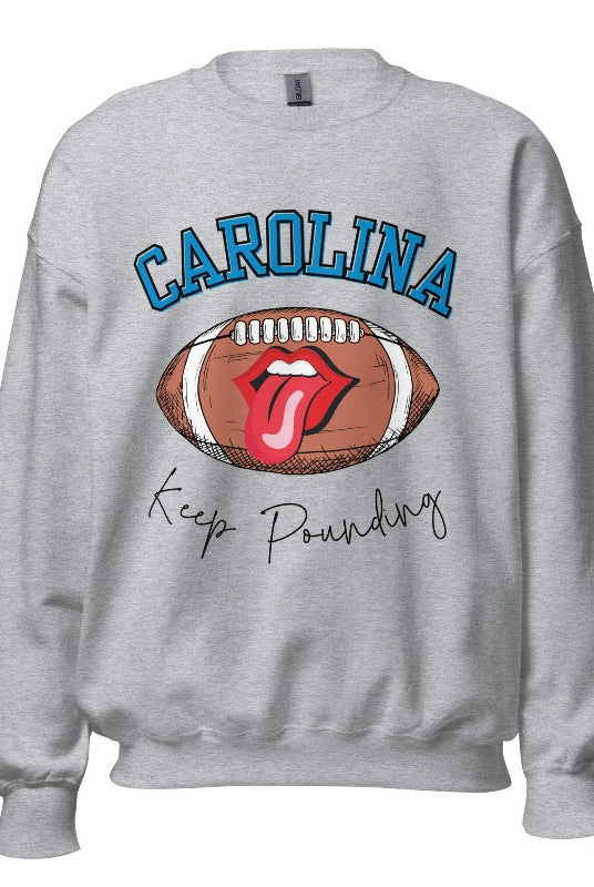 Support the Carolina Panthers in style with our modern and trendy sweatshirt featuring the team's name and powerful teams slogan, "Keep Pounding."  On a grey sweatshirt. 