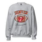 Get ready to show your support for the Denver Broncos in style with our exclusive sweatshirt featuring the team's iconic name and their slogan "uncommon." On a grey sweatshirt. 