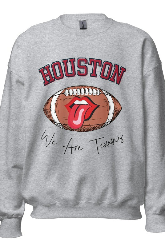 Embrace your Houston Texans pride with our exclusive sweatshirt. It features the team's name and an empowering slogan, "We Are Texans." On a grey sweatshirt. 