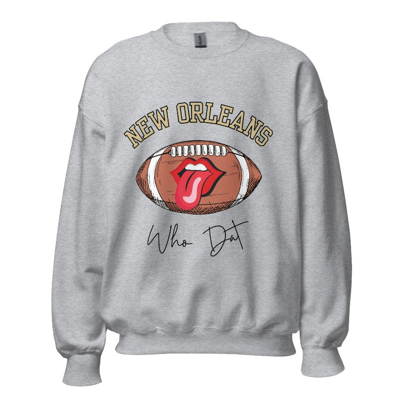 Get ready to represent the New Orleans Saints in style with this vibrant sweatshirt. Featuring a football and playful lips and tongue design, it proudly displays the team's iconic slogan "Who Dat" and the distinctive New Orleans wordmark on a grey sweatshirt. 