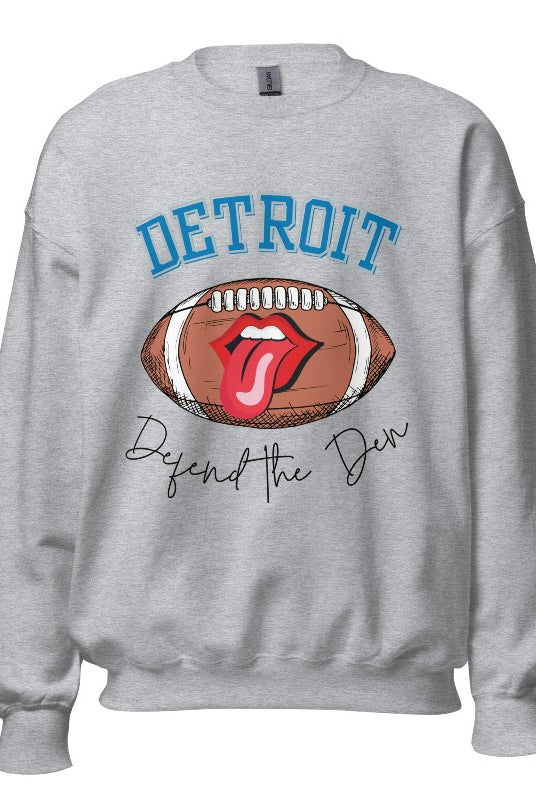 Get ready to show your Detroit Lions pride with this stylish sweatshirt featuring a football and playful lips and tongue design. Complete with the team's slogan "Defend the Den" and the iconic Detroit wordmark, this cozy grey sweatshirt. 
