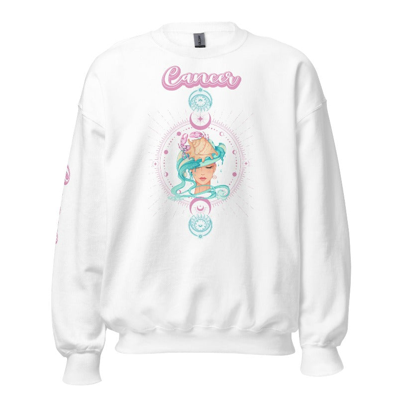 White Gildan sweatshirt featuring a vibrant Cancer zodiac design. The front showcases an artistic representation of a woman with flowing hair adorned with a crab, surrounded by celestial elements like moons and stars, in pastel colors. The word "Cancer" is written in a stylish pink script above the design. The sleeve also has "Cancer" written vertically in matching pink script.