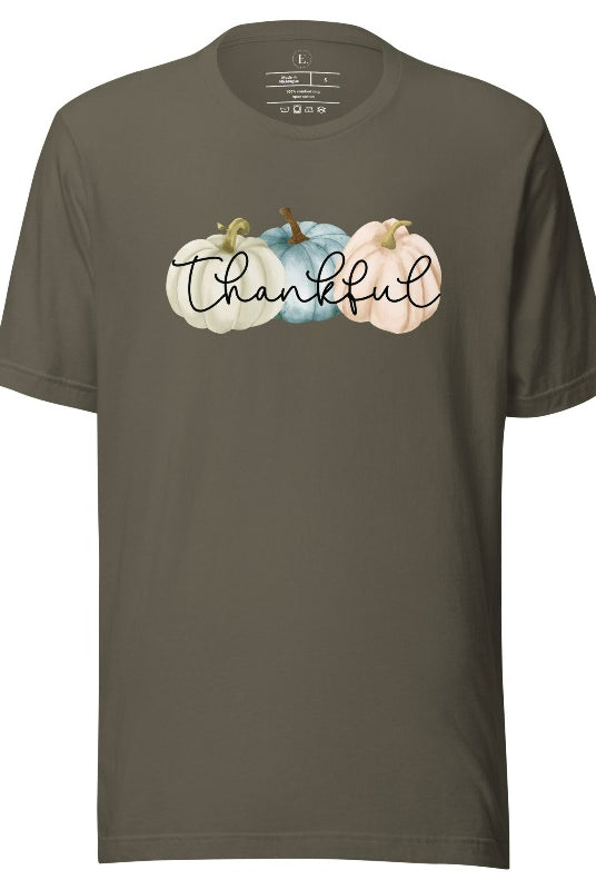 Express gratitude in style with our charming t-shirt. This design radiates autumn appreciation, featuring three pastel pumpkins and the word 'thankful' gracefully woven through the middle on an army colored shirt. 