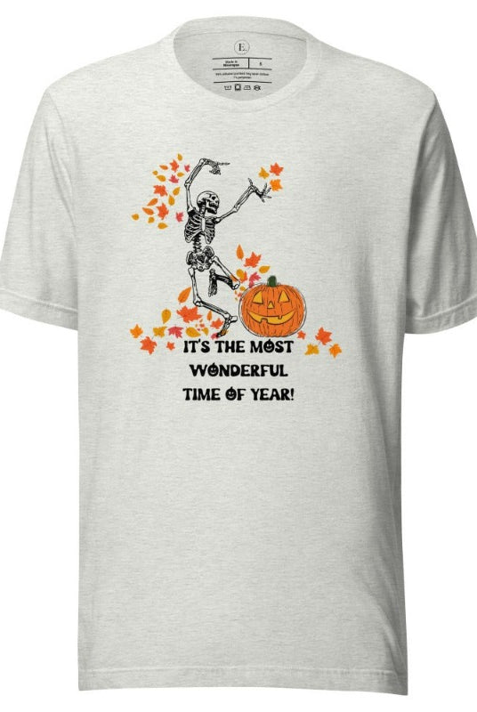 Dancing Skeleton in fall leaves with a jack-o-lantern with saying "It's the most wonderful time of year" on a ash colored shirt.