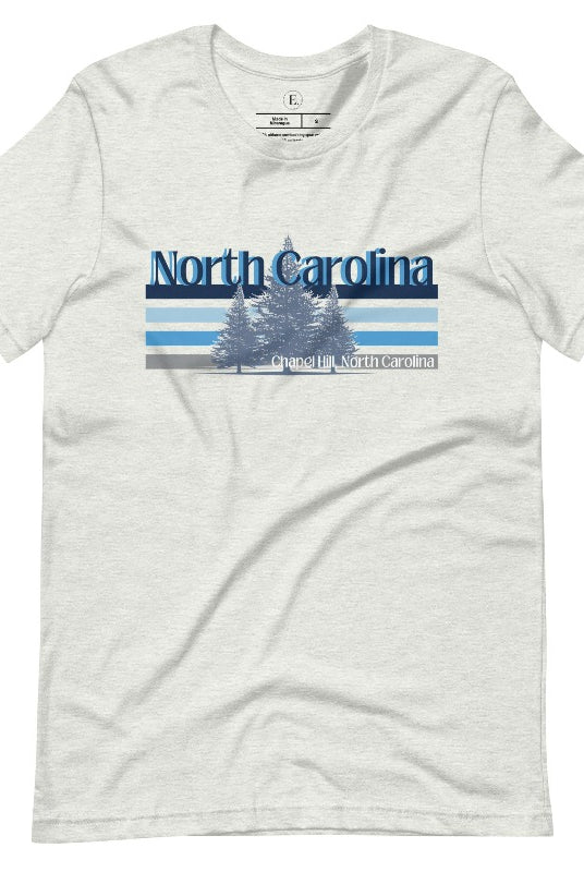 Show your school pride with this iconic North Carolina wordmark t-shirt. Made from premium materials, it features a North Carolina tree line in a the cool Carolina blue colors, representing a tradition of excellence for the nature that North Carolina offers on an ash shirt. 