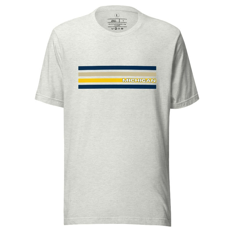 Revive retro collegiate fashion with our Michigan graphic tee. Bosting classic school colors and minimalist design, this men's shirt features distinctive chest stripes with "Michigan" in bold block lettering on an ash colored shirt. 