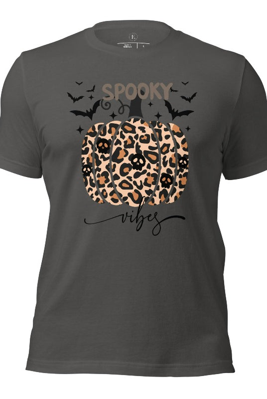 Get into Halloween spirit with our spooky vibes shirt featuring a unique cheetah print pumpkin adorned with skulls. As bats soar across the starry sky, embrace the eerie charm of this one-of-a-kind design on an asphalt colored shirt. 