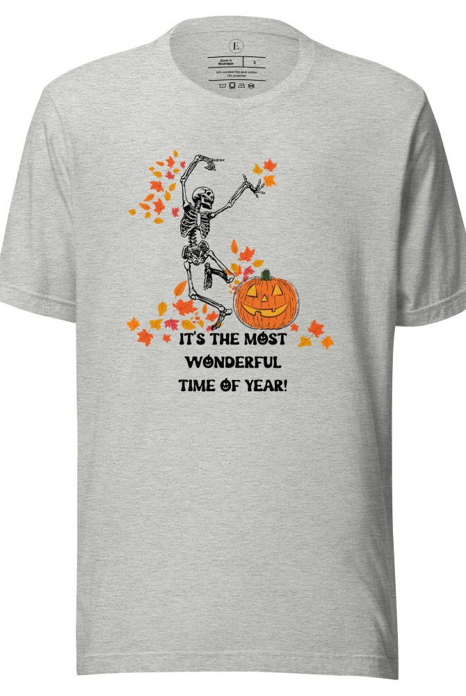 Dancing Skeleton in fall leaves with a jack-o-lantern with saying "It's the most wonderful time of year" on a atheltic heather grey colored shirt.