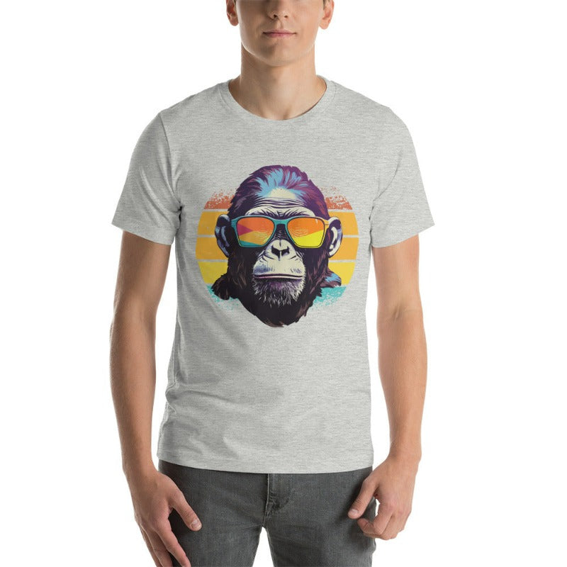 A gorilla wearing sunglasses Infront of a retro sunset on a athletic heather  colored shirt.