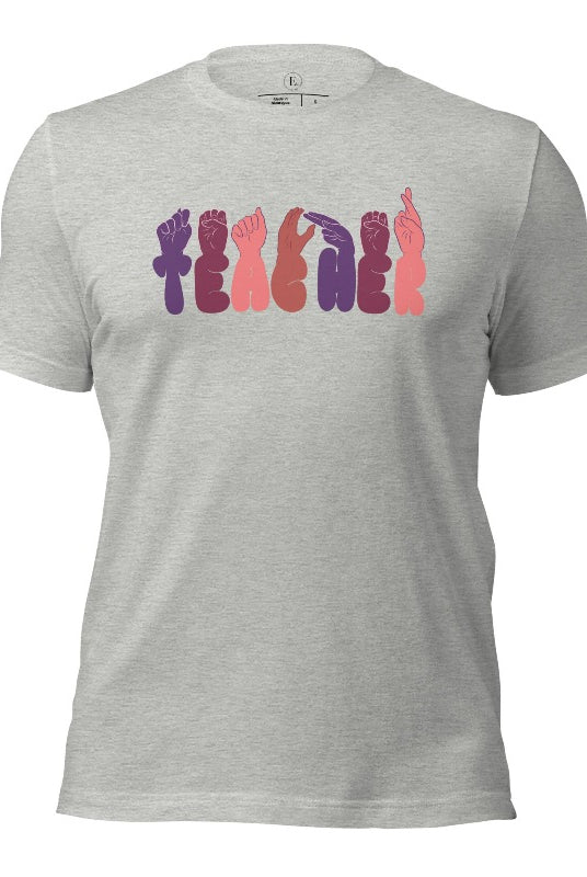 Let's celebrate our educators with this unique ASL teacher t-shirt. The word "teacher" is spelled out in American Sign Language using expertly crafted hands, highlighting their vital role in shaping our society. ASL teacher on a athletic heather grey colored shirt.
