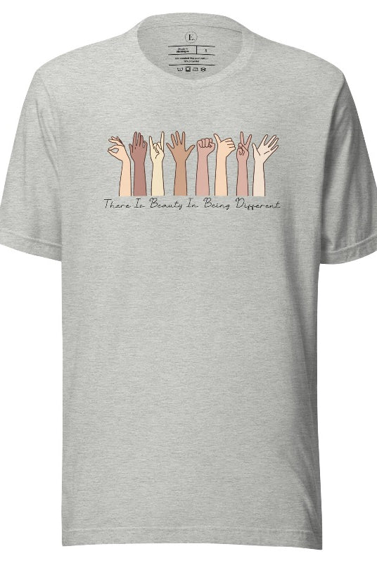 Celebrate diversity with this inspiring shirt, which features hands of different ethnicities and boldly declares "There is beauty in being different" on a athletic heather grey colored shirt.