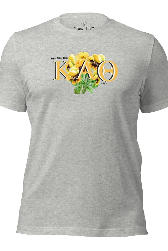Show your Kappa Alpha Theta pride with our sorority t-shirt! Our design features the sorority letters and a striking black and gold pansy, symbolizing sisterhood and strength on an athletic heather grey shirt. 