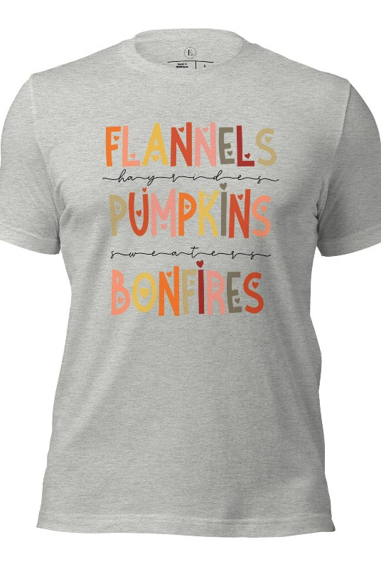 Embrace the cozy spirit of fall with our Flannel, Hayrides, Pumpkins, Sweaters, Bonfires shirt. Featuring the iconic fall elements, this shirt celebrates the season of warmth and comfort on an athletic heather grey shirt. 