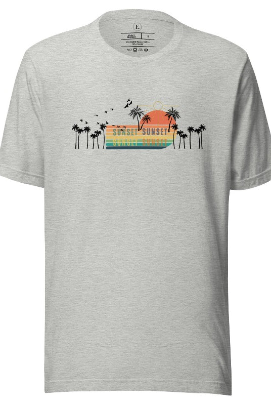 Transport yourself to a nostalgic beach getaway with our Retro Beach Shirt. Adorned with a captivating scene of a vintage sunset, palm trees, and seagulls soaring above on an athletic heather grey shirt. 