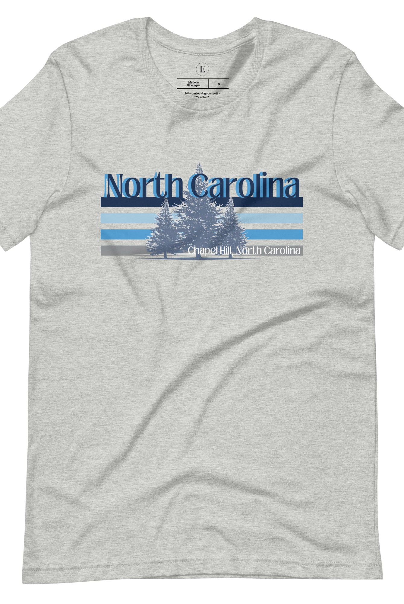 Show your school pride with this iconic North Carolina wordmark t-shirt. Made from premium materials, it features a North Carolina tree line in a the cool Carolina blue colors, representing a tradition of excellence for the nature that North Carolina offers on an athletic heather grey shirt. 
