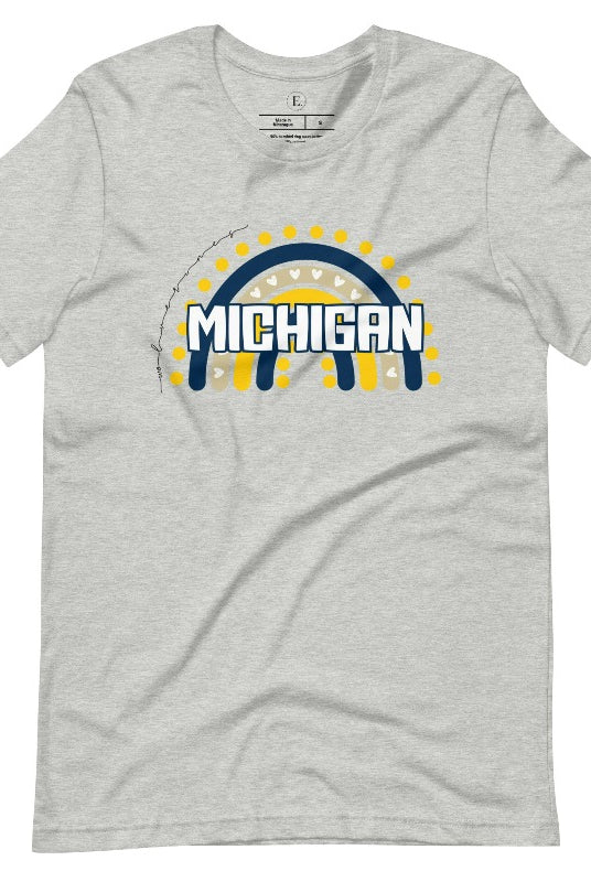 Unleash your vibrant spirit with our Michigan graphic tee. Adorned with a rainbow in school colors and "Michigan" in playful block bubble lettering, this shirt exudes energy and Wolverine pride on an athletic heather grey shirt. 