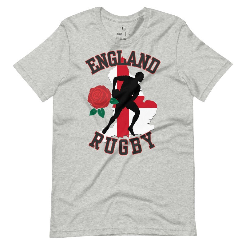 Introducing our England Rugby Graphic T-Shirt - the ultimate fusion of patriotism, rugby pride, and contemporary style! This captivating t-shirt features the words "England Rugby" and the iconic England flag artfully incorporated within the outline of the country, accompanied by a dynamic rugby player graphic on an athletic heather grey shirt. 