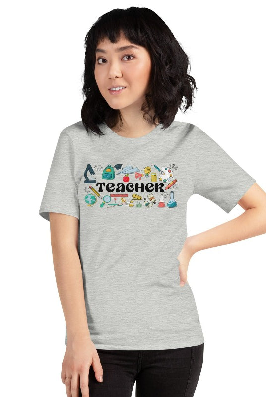 Teacher-themed graphic tee featuring the word 'Teacher' surrounded by all things related to teaching. Perfect for teacher shirts and teacher gifts. Grey graphic tees. 