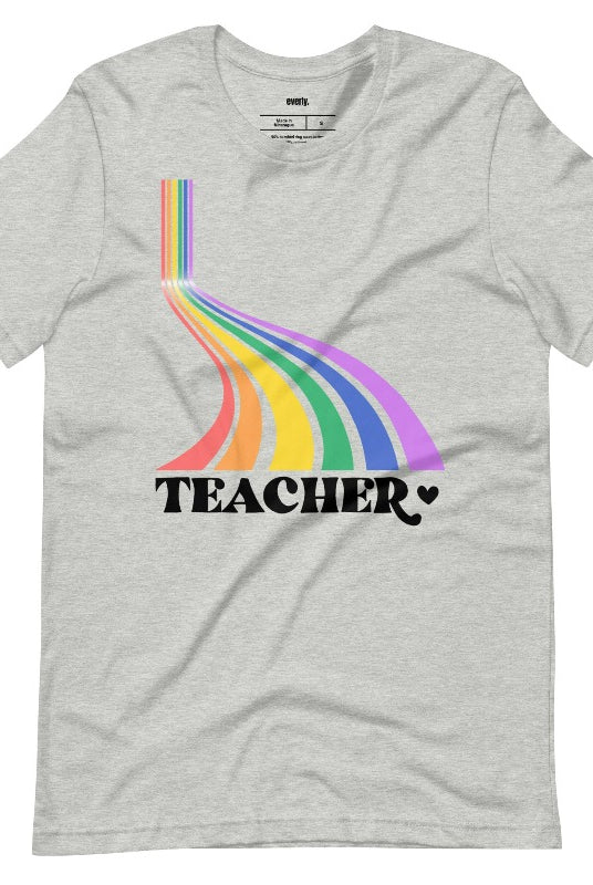 Colorful rainbow design with the word 'teacher' at the bottom, showcased on a teacher graphic tee. The perfect choice for teacher shirts and teacher gifts. Grey graphic tees.