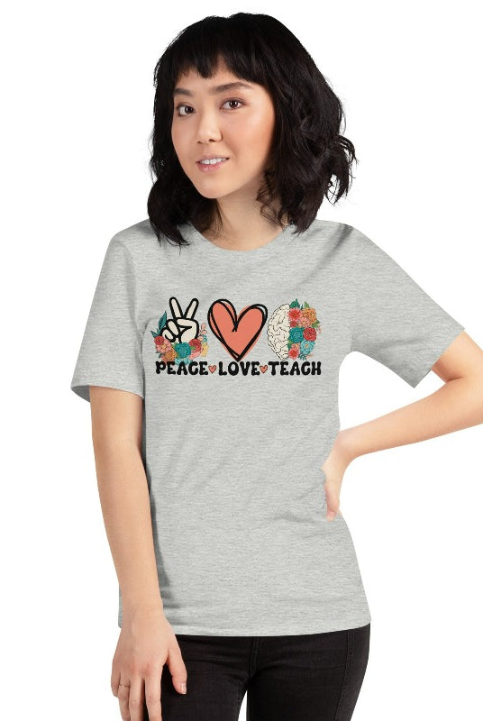 Floral design featuring the words 'peace love teach' on a teacher graphic tee - a great choice for teacher shirts and teacher gifts. Grey graphic tees. 