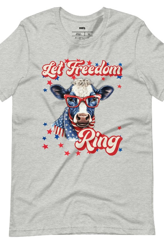 Graphic of a cow wearing sunglasses and a USA-themed scarf, with the text 'Let Freedom Ring' on the front of an athletic graphic tee.
