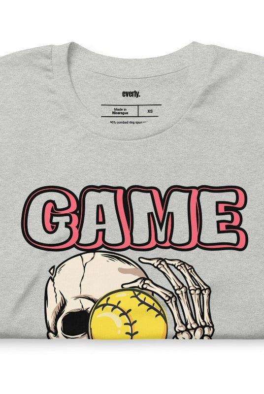 Softball game day skeleton skull holding a softball on a grey graphic tee.