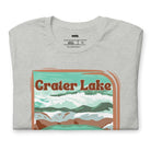 a colorful graphic of Crater Lake National Park, featuring mountains, water, and the text "Crater Lake National Park Oregon 1902 on a grey shirt. 