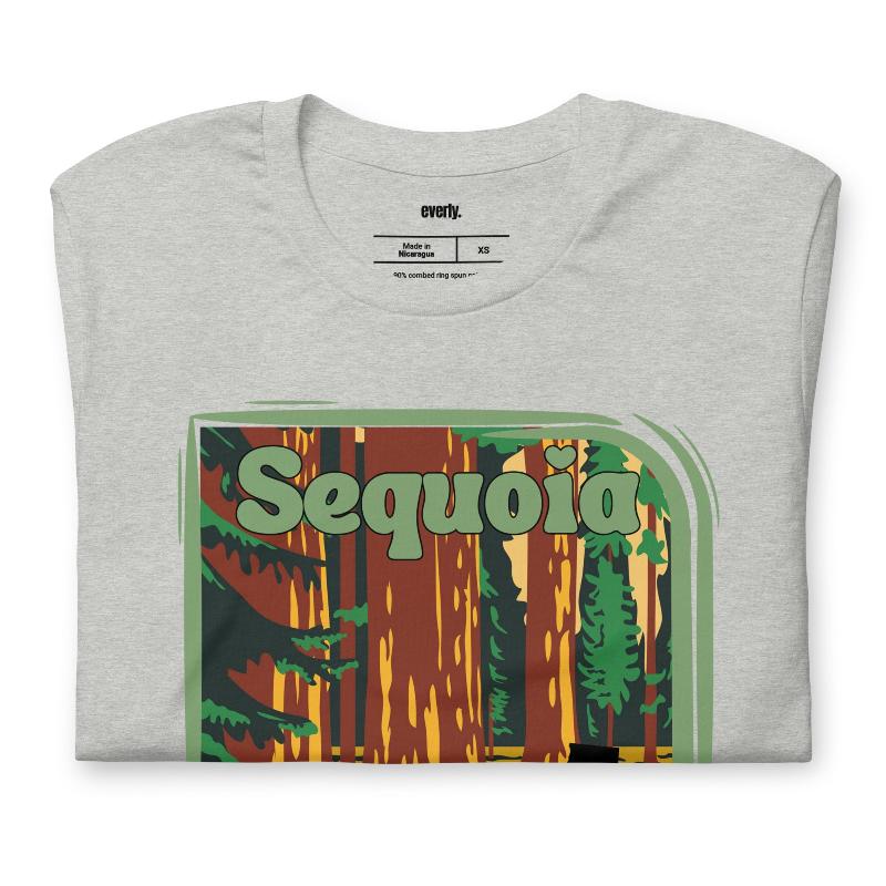 a vibrant illustration of Sequoia National Park, showcasing towering sequoia trees with a vintage-inspired design on a grey shirt.