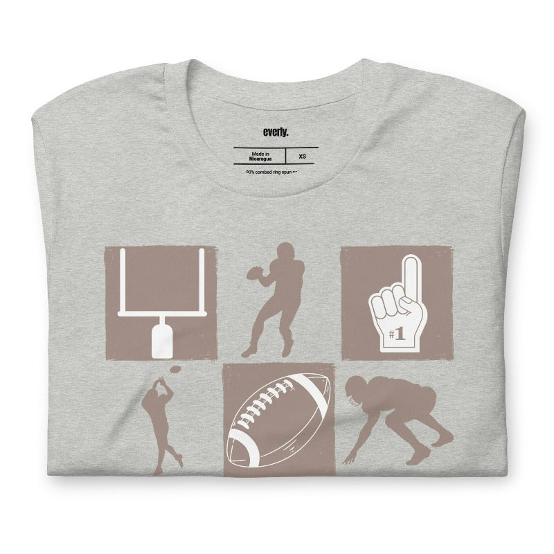 a design with various football-related icons, including a helmet, football, goalpost, players, and a "#1" foam finger, in a monochromatic brown tone on a grey shirt.