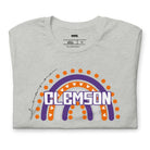 Bella + Canvas 3001 unisex shirt featuring a colorful rainbow design with the word "Clemson" in the center, representing Clemson University on a grey graphic tee.