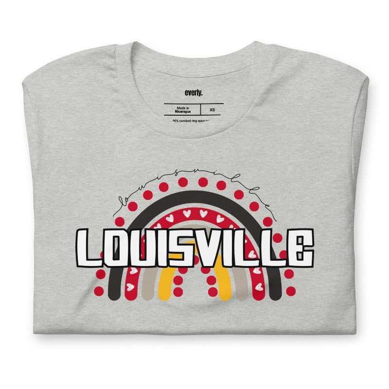 A vibrant rainbow design and the text "Louisville" in bold letters, perfect for showing University of Louisville spirit on a grey shirt.