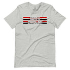 "North Carolina" in bold red and white text on a black and red striped background across the chest on a grey shirt.