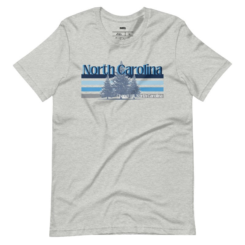 Serene Chapel Hill pine tree design with "North Carolina" and blue and white stripes on a grey graphic tee.