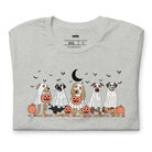 Grey t-shirt featuring a row of dogs dressed in ghost costumes with pumpkins, perfect for Halloween fun and dog lovers.