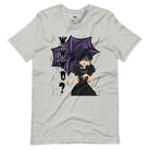 Grey t-shirt featuring a stylish goth girl dressed in black with a purple umbrella, along with the text "WWWD?" (What Would Wednesday Do?) in bold lettering.