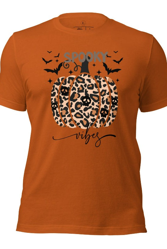 Get into Halloween spirit with our spooky vibes shirt featuring a unique cheetah print pumpkin adorned with skulls. As bats soar across the starry sky, embrace the eerie charm of this one-of-a-kind design on an autumn colored shirt. 