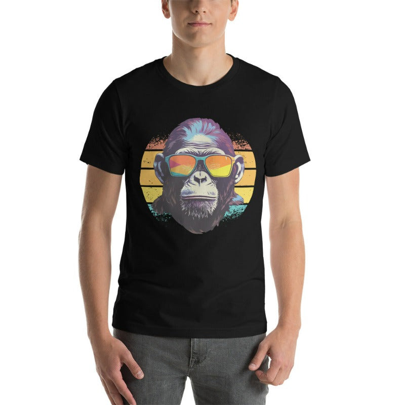A gorilla wearing sunglasses Infront of a retro sunset on a black colored shirt.