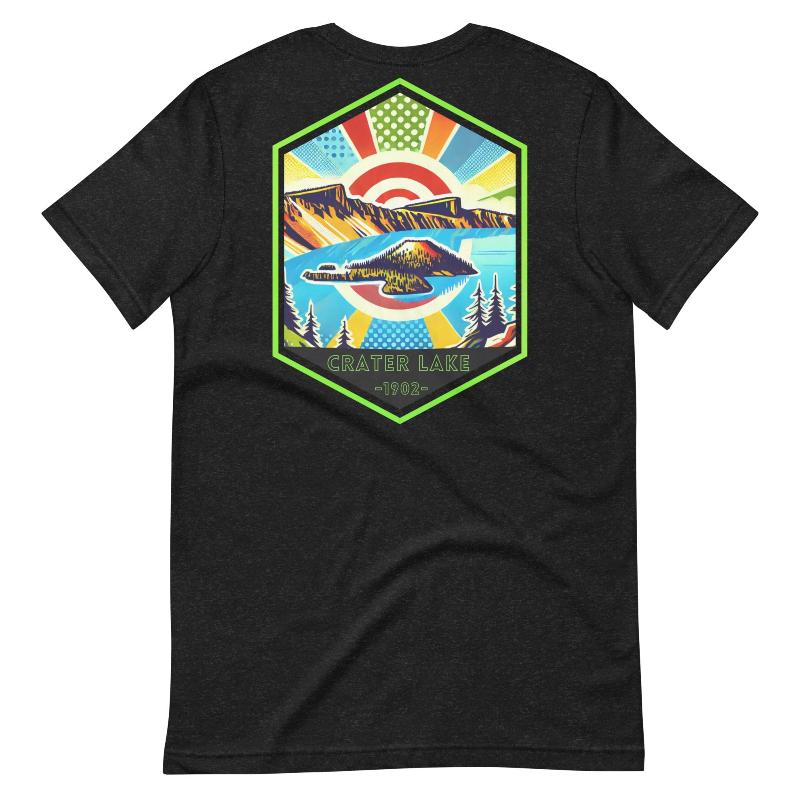 A vibrant design of Crater Lake National Park on the back, showcasing the lake and surrounding mountains in colorful hues, with the text "Crater Lake National Park | Oregon 1902" on the front. This design is on a black shirt. 