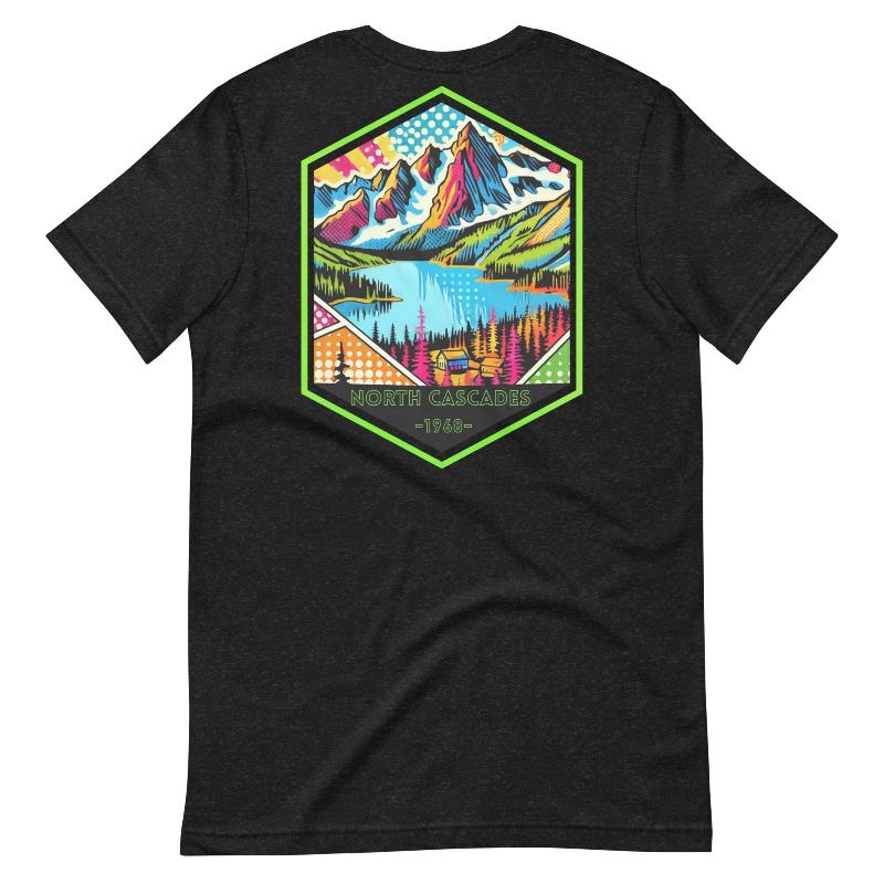 a vibrant, retro-style design of North Cascades National Park on the back, and "North Cascades National Park | Washington - 1968" text on the front on a black shirt.