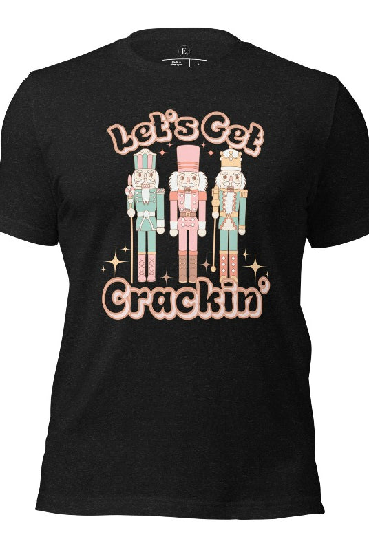 Get into the festive groove with our Christmas Nutcracker shirt that exclaims, "Let's Get Crackin'!" on a black heather colored shirt. 
