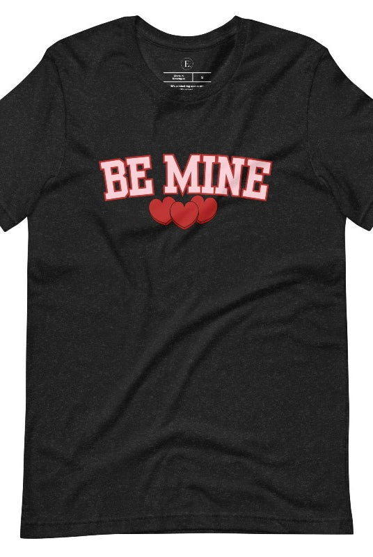 Elevate your Valentine's Day style with our "Be Mine" shirt! Featuring bold athletic lettering and three adorable hearts, on a black shirt.