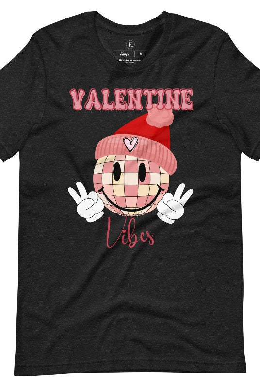 Get into the Valentine's Day spirit with our fun and funky shirt donning the words "Valentine Vibes" alongside a disco ball smiley face flashing peace fingers on a black shirt. 