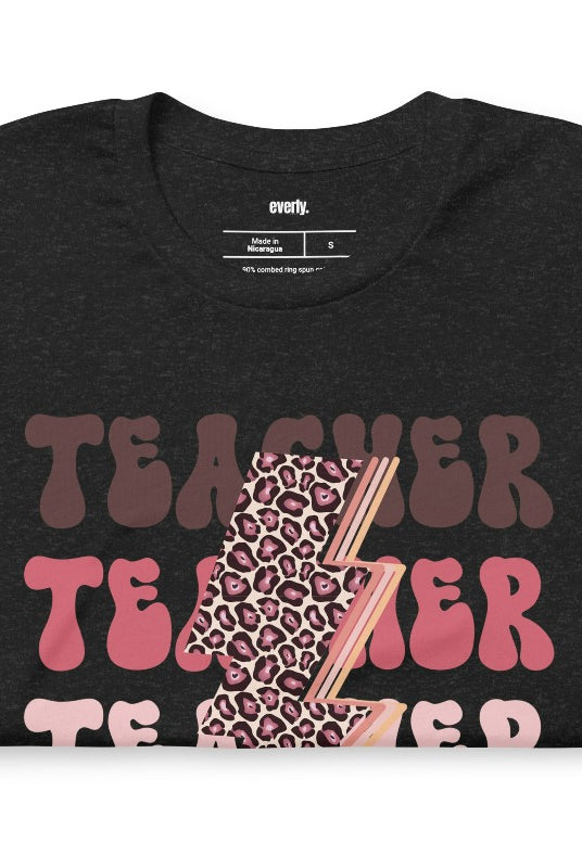 Black teacher graphic tee with pink cheetah lightning bolt and the word 'teacher' - perfect for teacher shirts and teacher gifts. Eye-catching graphic tee for educators.