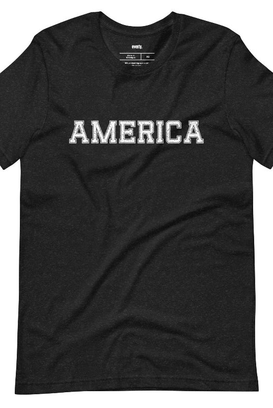 Close-up image of a USA July 4th graphic tee with the word 'America' spelled out in cool sports lettering on the front. This fun and stylish tee is perfect for showing off your patriotic spirit and celebrating the 4th of July in true American style on a black tee. 