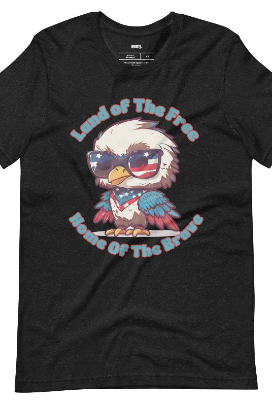 Graphic of a bird wearing sunglasses and a USA-themed scarf, with the text 'Land of the Free, Home of the Brave' on the front of a black graphic tee.