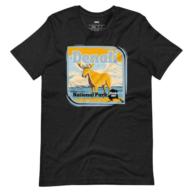 Heather Black Bella + Canvas 3001 t-shirt featuring a colorful Denali National Park graphic with a moose and mountains, showcasing the beauty of Alaska's wilderness